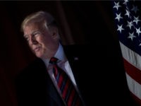 trump-shadow-flag-getty BRENDAN SMIALOWSKI/AFP/Getty Images