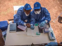 who-workers-administer-ebola-vaccine-dr-congo-5-18-getty Nurses working with the World Health Organization (WHO) prepare to administer vaccines at the town all of Mbandaka on May 21, 2018 during the launch of the Ebola vaccination campaign. - The death toll in an outbreak of Ebola in the Democratic Republic of Congo (DRC) rose to 26 on …