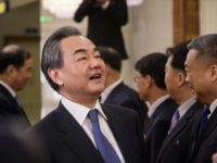 China's foreign minister Wang Yi (L) laughs as he shakes hands with North Korea's vice foreign minister Ri Kil Song at Pyongyang airport China's foreign minister Wang Yi (L) laughs as he shakes hands with North Korea's vice foreign minister Ri Kil Song at Pyongyang airport