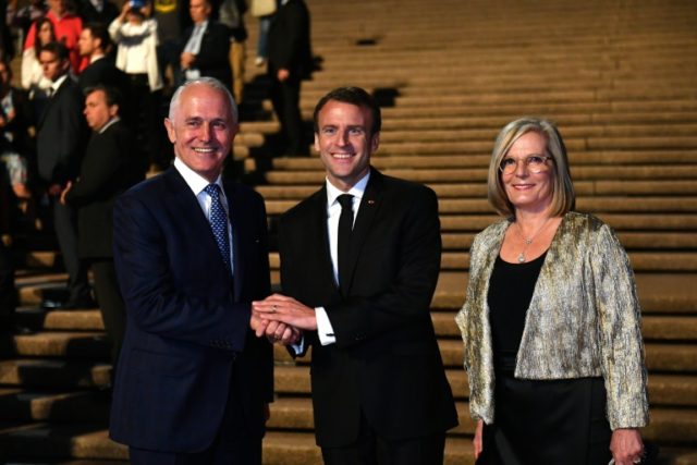 Global giggles as Macron praises Aussie leader's 'delicious' wife