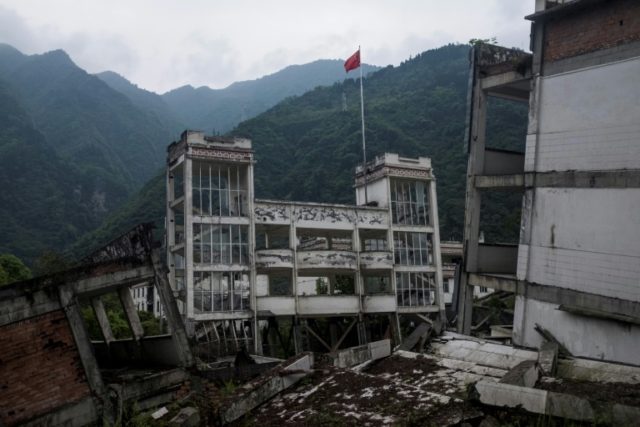 China quake survivors relive trauma for tourists in city ruins