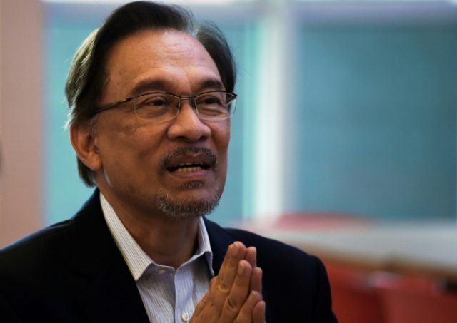 Malaysia king to pardon opposition's Anwar, paving way for return to politics