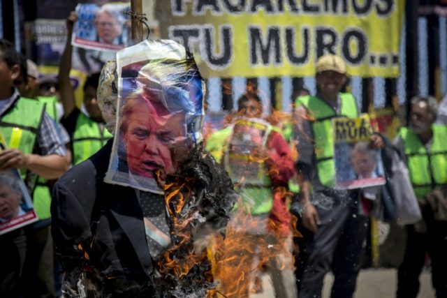 Migrants in Mexico stage colorful anti-Trump protest