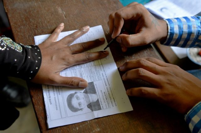 Voter card storm clouds key Indian state election