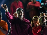 Venezuela's Nicolas Maduro waves to supporters after he was declared the winner of the presidential election Maduro wins as rivals call for new Venezuela elections