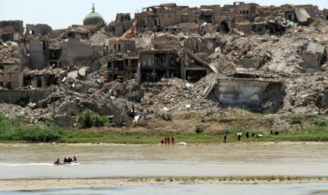 Nearly a year since fall of Iraq's Mosul, hunt for bodies goes on
