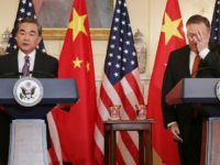 Chinese Foreign Minister Wang Yi (L), Mike Pompeo (R) Chinese Foreign Minister Wang Yi (L) warned against the case being 'politicised' while Mike Pompeo (R) said it was 'very similar' to what happened in Cuba