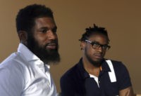 Starbucks Black Men Arrested FILE – In this April 18, 2018, file photo, Rashon Nelson, left, and Donte Robinson, right, both 23, listen to a reporter's question during an interview with The Associated Press in Philadelphia. The two black men, arrested for sitting at a Starbucks cafe in Philadelphia without ordering anything, settled with the city of Philadelphia for a symbolic $1 each Wednesday, May 2, 2018, and a promise from city officials to set up a $200,000 program for young entrepreneurs. (AP Photo/Jacqueline Larma, File) The Associated Press