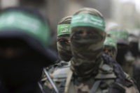Israel Palestinians Masked Palestinian Hamas gunmen attend a funeral for six of their fighters who were killed in an explosion Saturday, in Deir el Balah, central Gaza Strip, Sunday, May 6, 2018. Hamas is vowing revenge after blaming Israel for the explosion. (AP Photo/Khalil Hamra) The Associated Press