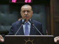 Turkey's President Recep Tayyip Erdogan gesture as he delivers a speech to members of his ruling Justice and Development (AKP) Party, during its weekly meeting in Ankara, Turkey, Tuesday, May 8, 2018. Erdogan has reacted angrily to a group of some 300 well-known French personalities who urged prominent Muslims, by signing a manifesto which was published in Le Parisien newspaper on Sunday, to denounce anti-Jewish and anti-Christian references in the Quran, Islam's holy book. (Kayhan Ozer/Presidency Press Service via AP, Pool)