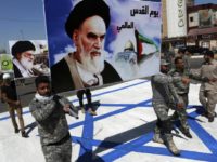In this June 23, 2017 file photo, supporters of Iraqi Hezbollah brigades march on a representation of an Israeli flag with a portrait of late Iranian leader Ayatollah Khomeini and Iran's supreme leader Ayatollah Ali Khamenei, in Baghdad, Iraq. There may not be much Iran can do about President Donald Trumps withdrawal from the nuclear deal, but across the Middle East, the Islamic Republic has a variety of ways it can hit back at the United States and Americas regional allies. Iran sponsors a range of Shiite militias in Iraq and enjoys deep ties to the countrys economy and political system. (AP Photo/Hadi Mizban, File)
