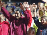 Venezuela Presidential Election Nicolas Maduro Venezuela's President Nicolas Maduro and his wife Cilia Flores wave to supporters at the presidential palace in Caracas, Venezuela, Sunday, May 20, 2018. Electoral officials declared the socialist leader the winner of Sunday's presidential election, while his leading challenger questioned the legitimacy of a vote marred by irregularities and called for a new ballot to prevent a brewing social crisis from exploding. (AP Photo/Ariana Cubillos) Nicolas Maduro