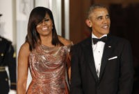 Netflix Obamas Barack Obama, Michelle Obama, In this Oct. 8, 2016 file photo, President Barack Obama and first lady Michelle Obama wait to greet Italian Prime Minister Matteo Renzi and his wife Agnese Landini for a State Dinner at the White House in Washington. Netflix says that it has reached a deal with Barack and Michelle Obama to produce material for the streaming service. Netflix said Monday, May 21, 2018, in a tweet, that the former president and first lady will produce films and series for the service, potentially including scripted and unscripted series, documentaries and features. (AP Photo/Pablo Martinez Monsivais, File) Barack Obama, Michelle Obama,