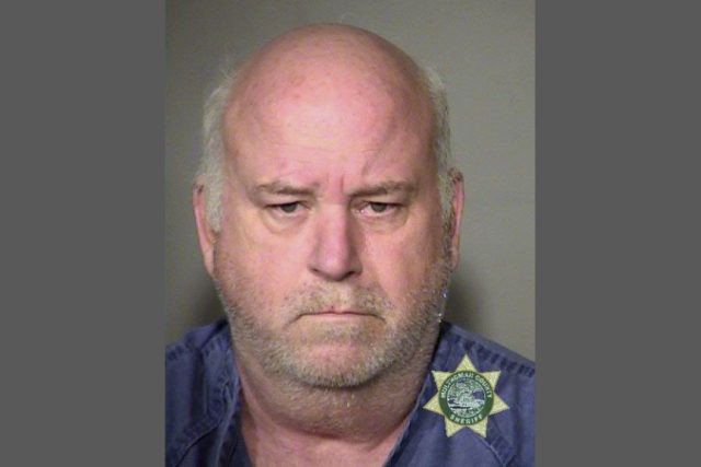 Portland Hit and Run A photo provided by the Portland (Ore.) Police Bureau shows Greg Phillip Porter, 61, who is being held at the Multnomah County jail on several counts, including three counts each of attempted murder and assault, in connection with a hit and run. A driver rammed into three women walking on a sidewalk Friday, May 25, 2018, in downtown Portland, critically injuring one of them, before speeding away and being arrested within hours of the crash, authorities said. (Portland Police Bureau via AP) The Associated Press