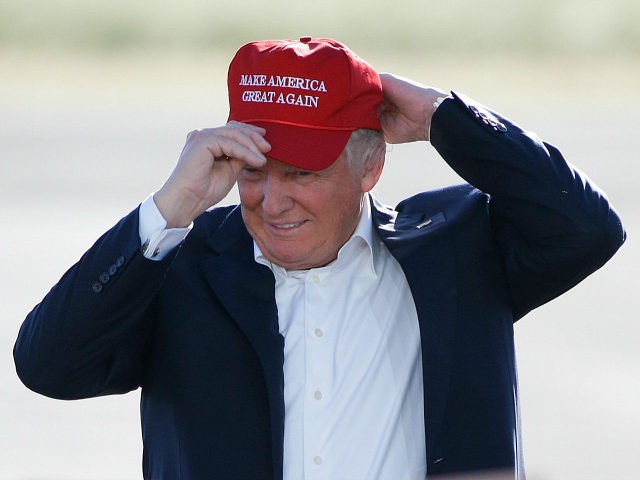 FILE - In this June 1, 2016, file photo, Republican presidential candidate Donald Trump wears his "Make America Great Again" hat at a rally in Sacramento, Calif. Trump’s “Make America Great Again” hats proudly tout they are “Made in USA.” Not necessarily always the case, an Associated Press review found. …
