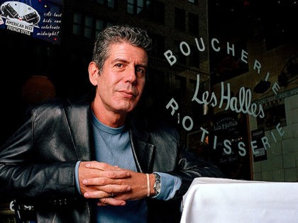 FILE-This dec. 19, 2001 file photo shows Anthony Bourdain the owner and chef of Les Halles restaurant sitting at one of its tables in New York. (AP Photo/Jim Cooper,File)