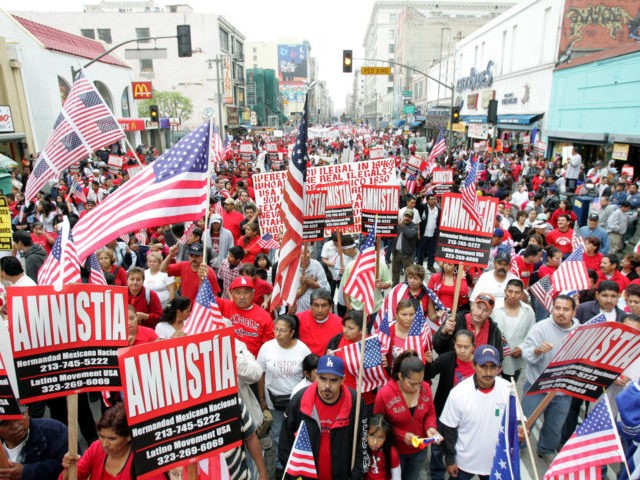 ** FOR STORY DECADA-HISPANOS ** FILE - In this April 7, 2007 file photo, demonstrators calling for immigration reform march during an immigration protest rally in Los Angeles. Marchers filled the streets to demand amnesty for the nation's estimated 12 million illegal immigrants. (AP Photo/Stefano Paltera, File)