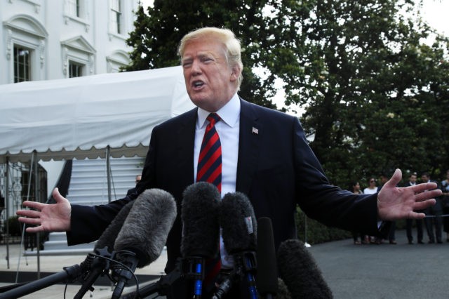 President Donald Trump speaks to reporters before leaving the White House in Washington, F