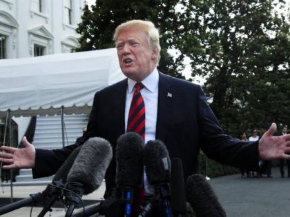 President Donald Trump speaks to reporters before leaving the White House in Washington, F