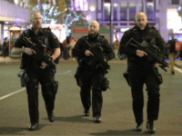 TOPSHOT - Armed police patrol near Oxford street as they respond to an incident in central London on November 24, 2017. British police said they were responding to an 'incident' at Oxford Circus in central London on Friday and have evacuated the Underground station, in an area thronged with people …