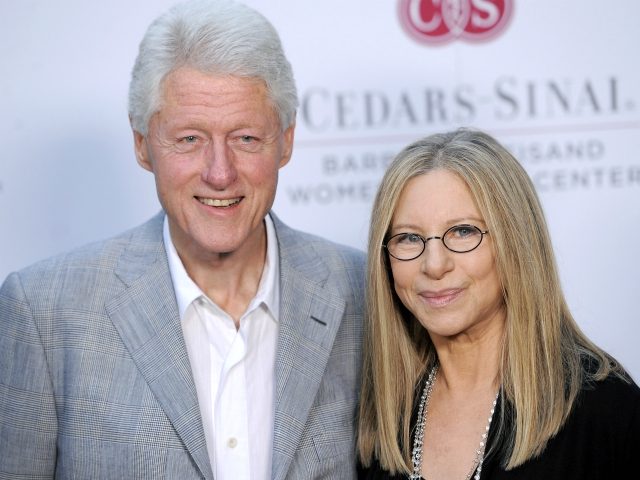 Former President Bill Clinton poses with Barbra Streisand at the dedication of the Barbra