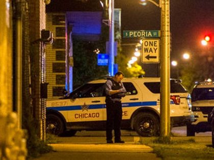 Chicago police investigate the June 4 shooting death of 11-year-old Jechon Anderson. (AP P