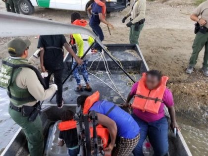 Eagle Pass Border Patrol agents rescue two adults and five minors from the Rio Grande River. (Photo: U.S. Border Patrol)