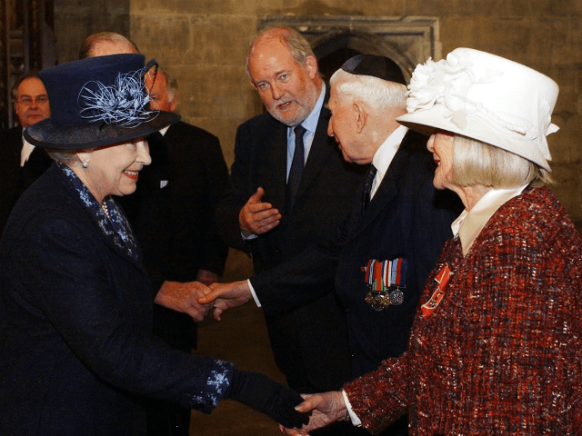 Britain's Queen Elizabeth II, left, meets Holocaust survivor Gena Turgel during a service
