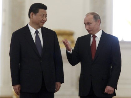 Russia's President Vladimir Putin (R) and his Chinese counterpart Xi Jinping meet in the Grand Kremlin Palace in Moscow, on March 22, 2013. Xi Jinping arrived today in Moscow on his first foreign trip, to cement ties between the two countries by inking a raft of energy and investment accords. …