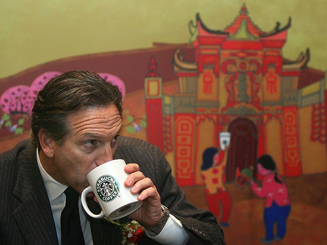 CHONGQING, CHINA - FEBRUARY 16: (CHINA OUT) Howard Schultz, president of the US Starbucks coffee chain, drinks a cup of coffee in the first Starbucks store on February 16, 2006 in Chongqing Municipality, China. Starbucks is taking the plunge into the Chongqing market. The Chinese coffee market is expected to …