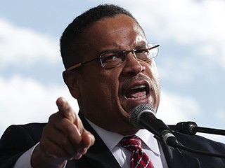 WASHINGTON, DC - DECEMBER 07: U.S. Rep. Keith Ellison (D-MN) (C) speaks during a rally on