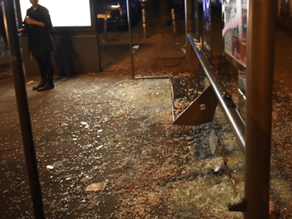 HAMBURG, GERMANY - JULY 07 : Smashed glass of a bus stop is left by left-wing protestors during a march on July 7, 2017 in Hamburg, Germany. Leaders of the G20 group of nations are arriving in Hamburg today for the July 7-8 economic summit and authorities are bracing for …