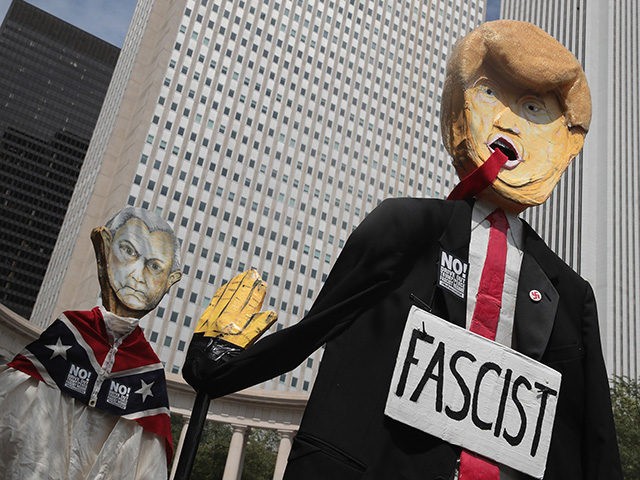 CHICAGO, IL - AUGUST 13: Demonstrators protesting the alt-right movement and mourning the victims of yesterdays rally in Charlottesville, Virginia carry puppets of President Donald Trump and U.S. Attorney General Jeff Sessionson August 13, 2017 in Chicago, Illinois. One person was killed and 19 others were injured in Charlottesville when …
