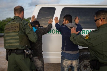 Border Patrol agents apprehend illegal immigrants shortly after they crossed the border from Mexico into the United States on Monday, March 26, 2018 in the Rio Grande Valley Sector near McAllen, Texas.