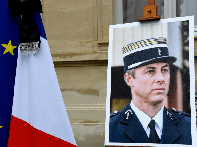 a portrait of French Lieutenant-Colonel Arnaud Beltrame is pictured during a minute of sil