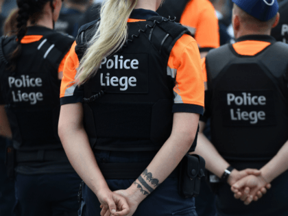 Liege police take part in a tribute ceremony for the vicitms of a shooting in Liege on May 30, 2018. - An attack that killed two policewomen and a male bystander in the eastern Belgian city of Liege on May 29, 2018 amount to 'terrorist murder,' prosecutors spokesman said during …