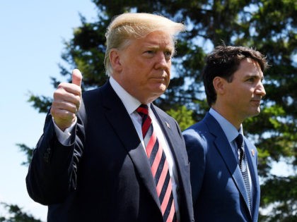 QUEBEC CITY, QC - JUNE 08: U.S. President Donald Trump (L) gives a thumbs up to the media as he is greeted by Prime Minister of Canada Justin Trudeau during the G7 official welcome at Le Manoir Richelieu on day one of the G7 meeting on June 8, 2018 in …