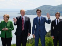 Heads Of State Attend G7 Meeting In Quebec - Day One LA MALBAIE , QC - JUNE 08: German Chancellor Angela Merkel, US President Donald Trump, Canada's Prime Minister Justin Trudeau and , French President Emmanuel Macron wave during the Family photo on the first day of the G7 Summit, on 8 June, 2018 in La Malbaie, Canada. Canada will host …