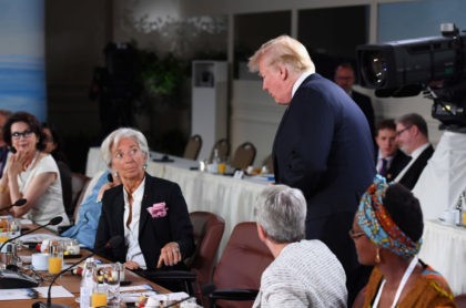 QUEBEC CITY, QC - JUNE 09: Christine Lagarde looks up at US President Donald Trump as he a