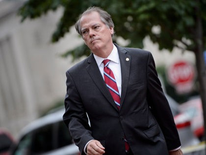 James Wolfe, former director of security for the Senate Intelligence Committee, walks into