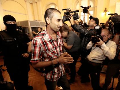 The main defendant Samsoor Lahoo (C) arrives for his trial on June 14, 2018 in Kecskemet,