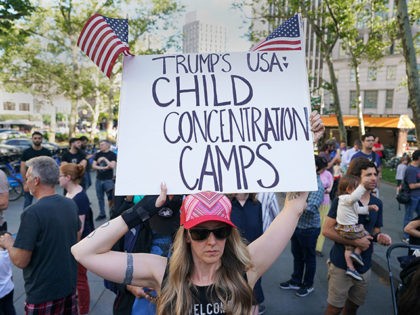People attend a rally protesting the separation of children from their families while crossing the US border illegally on June 14, 2018 in New York. (Photo by Don EMMERT / AFP) (Photo credit should read DON EMMERT/AFP/Getty Images)