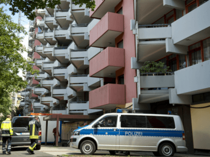 A police car stands on June 15, 2018 in front of an apartment building in Cologne's Chorweiler district, where a Tunisian suspected of trying to build a biological weapon was arrested three days before. - The 29-year-old man, identified as Sief Allah H, was detained after police stormed his flat …