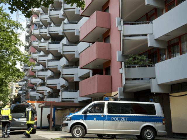 A police car stands on June 15, 2018 in front of an apartment building in Cologne's Chorwe
