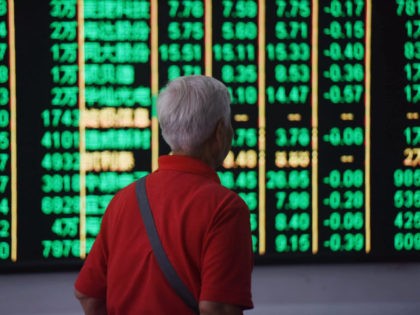 HANGZHOU, CHINA - JUNE 19: An investor watches the electronic board at a stock exchange h