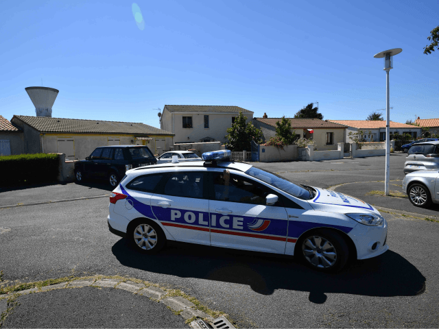 Police officers drive a car on June 25, 2018 in Tonnay-Charente near the house of Guy S., the alleged leader of a group linked with the ultra right 'AFO' (Action of Operational Forces) who was arrested along with 9 other people in France for allegedly planning attacks against Muslims in …