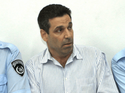 Former Israeli energy minister Gonen Segev (C) appears at the Tel Aviv district tribunal 22 April 2004. Segev was remanded in custody after having been arrested on suspicion of attempted drug-trafficking. The court ordered that Segev remain in custody until April 28. Segev, who had served as a minister in …