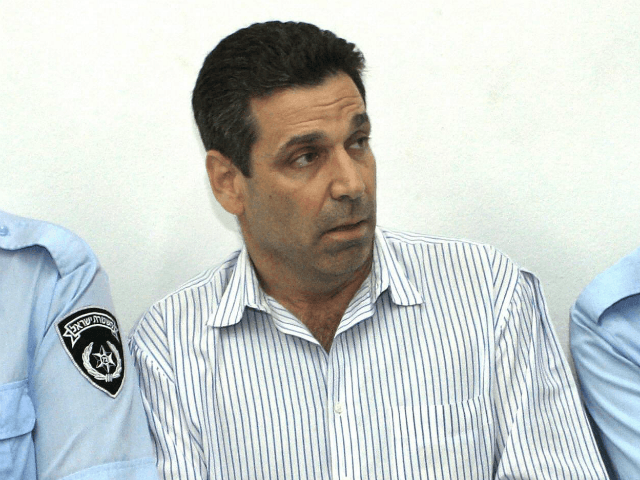 Former Israeli energy minister Gonen Segev (C) appears at the Tel Aviv district tribunal 22 April 2004. Segev was remanded in custody after having been arrested on suspicion of attempted drug-trafficking. The court ordered that Segev remain in custody until April 28. Segev, who had served as a minister in …