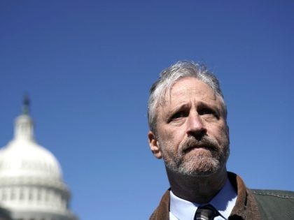 Comedian Jon Stewart talks to a member of the media after a news conference March 5, 2018 on Capitol Hill in Washington, DC. Stewart took part in a news conference to urge White House Budget Director Mick Mulvaney not to cut the World Trade Center Health Program, which provides medical …