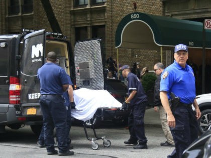 The body of fashion designer Kate Spade is removed from her Park Avenue apartment Tuesday, June 5, 2018 in New York. Law enforcement officials say Spade apparently hanged herself in the bedroom of her apartment. The officials say she was found by housekeeping staff and left a note at the …